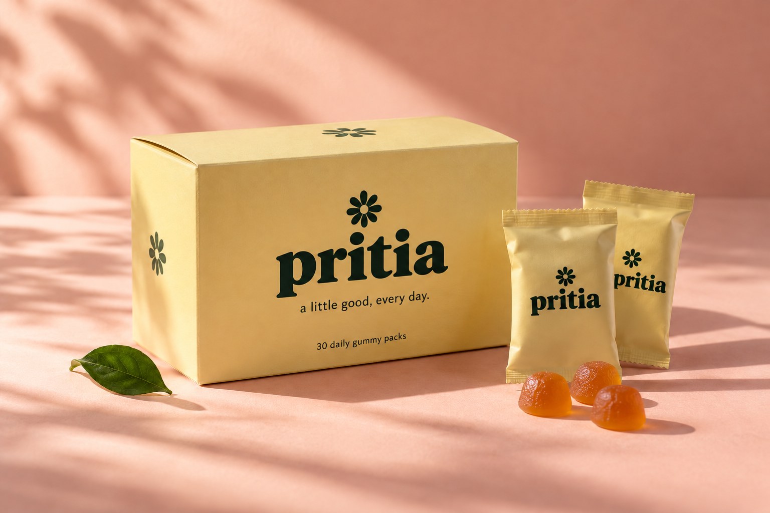 pritia packaging concept: a butter-yellow box and daily gummy sachets on a sunlit peach backdrop